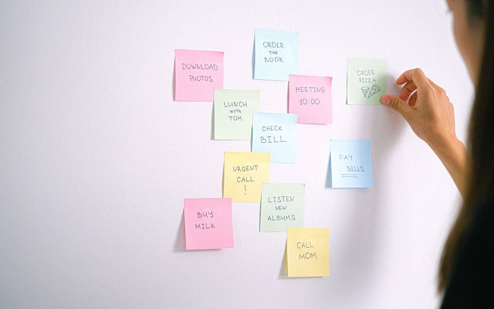 An office whiteboard covered in a live-service content calendar — named content drops, dates, arrows — photographed straight-on